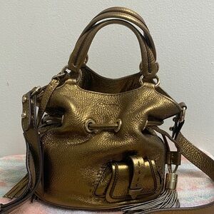 Lancel bucket bag in gold leather
